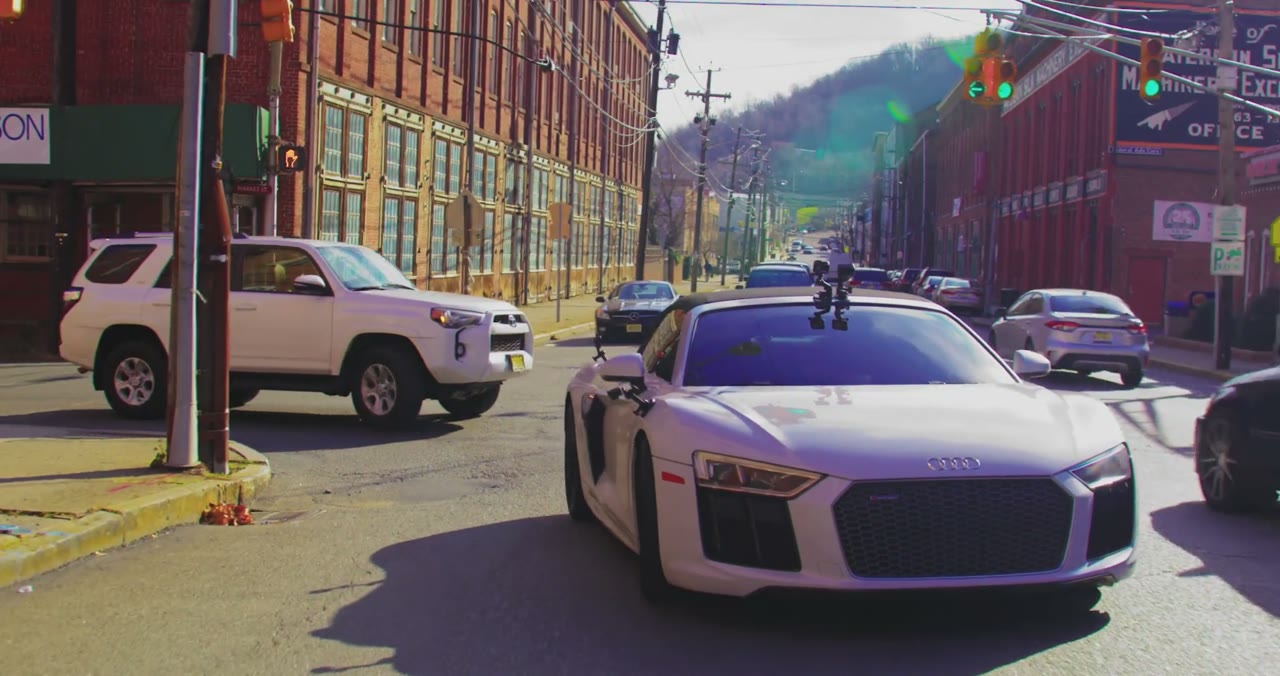 The hero car is the episode — rolling through Paterson
